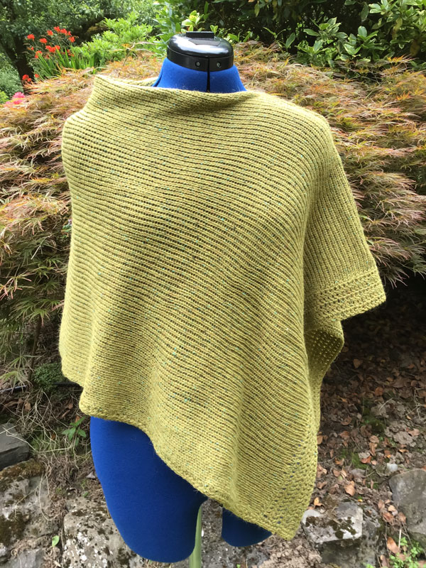Knit and crochet poncho in the yarn HIKOO, Kenzie, Kiwi Fruit